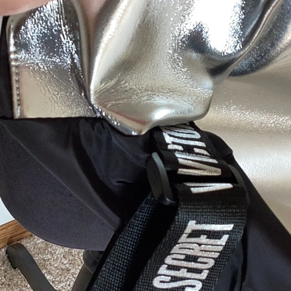 VICTORIA’S Secret black and silver backpack.